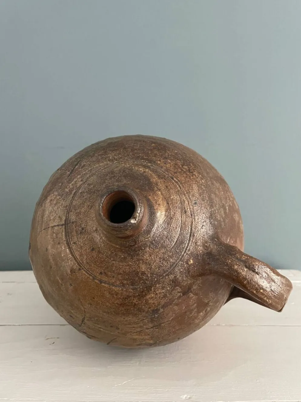 Grande bouteille à huile XIXème en terre vernissée