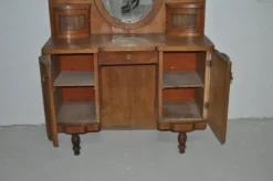 Grande coiffeuse vintage en bois marron avec miroir ovale et rangements intégrés