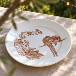 Grand plat rond de 1870 signé Longwy aux oiseaux terre de fer sépia