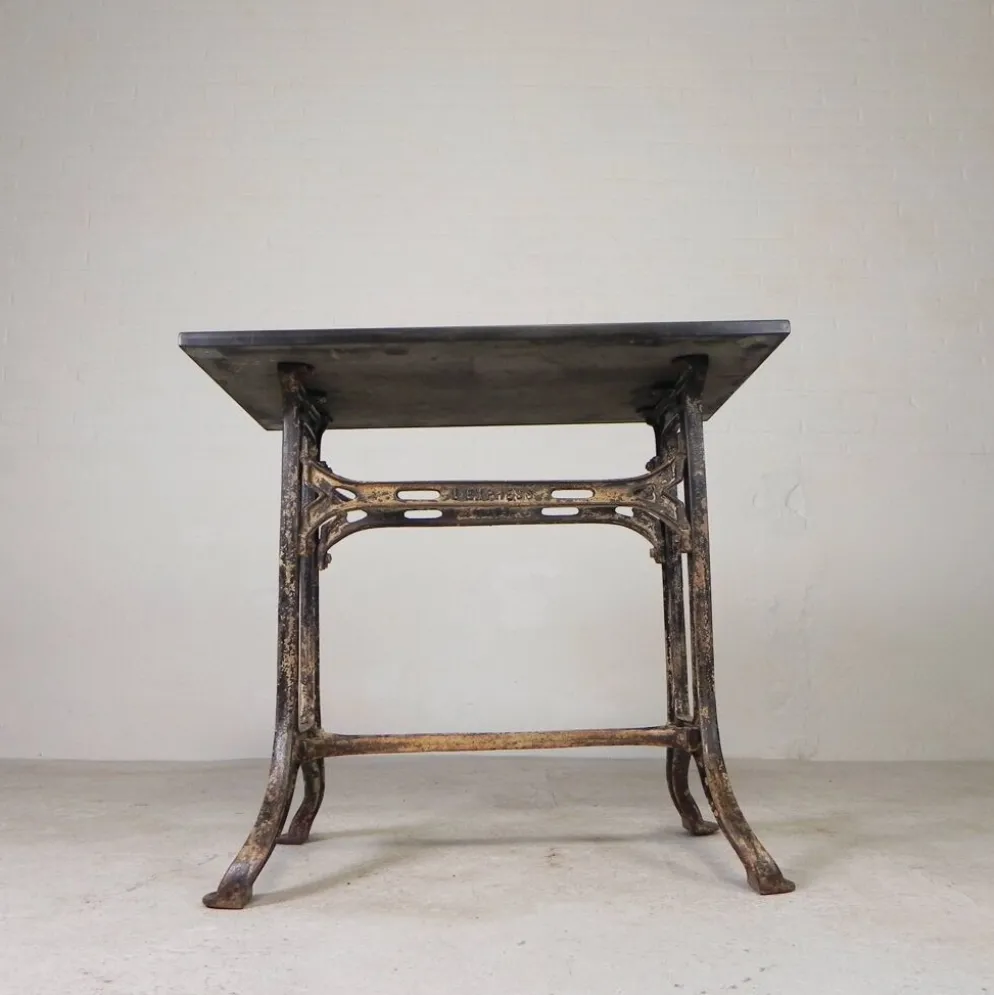 Industrial table, garden table with hard stone slab on cast iron frame, 1930s