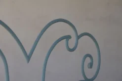 Lit en fer forgé volutes