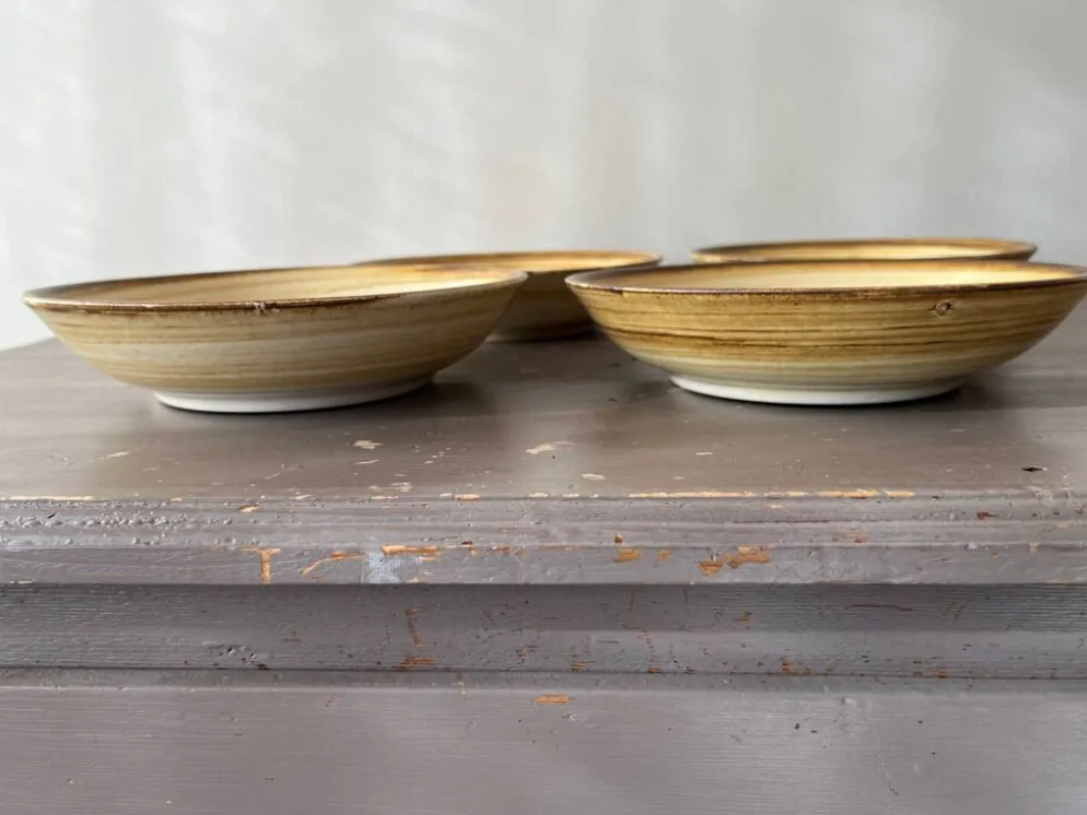 Lot de 4 assiettes creuses signées Longchamp