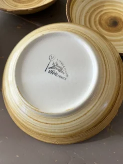 Lot de 4 assiettes creuses signées Longchamp