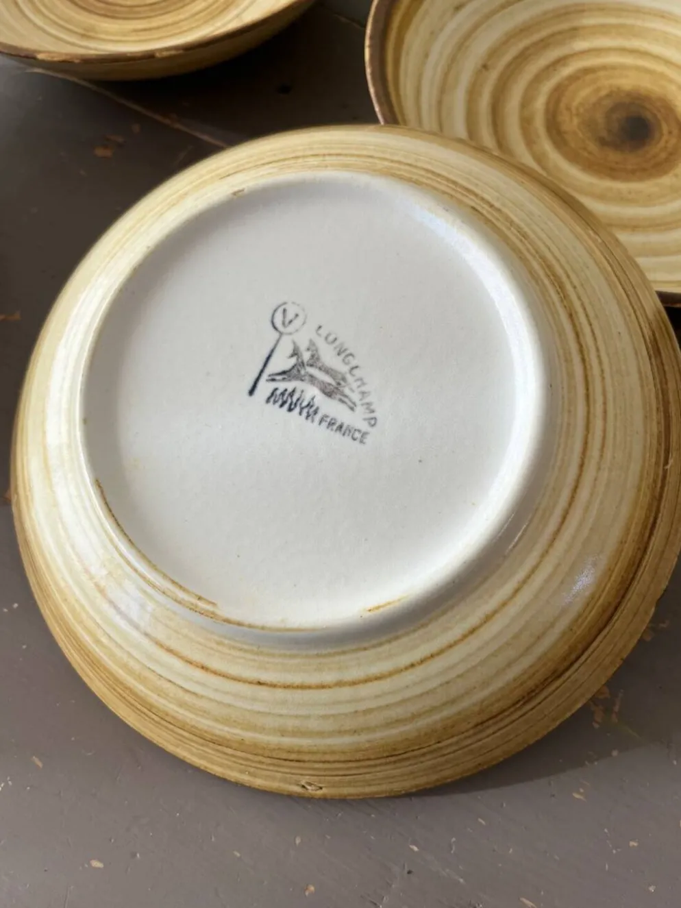 Lot de 4 assiettes creuses signées Longchamp