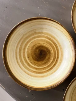 Lot de 4 assiettes creuses signées Longchamp