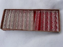 Lot de douze porte couteaux en cristal dans leur boite