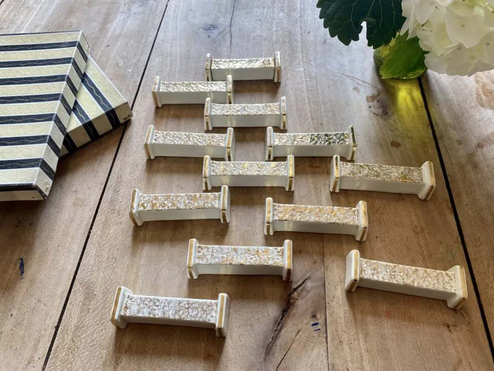 Lot de 10 porte-couteaux vintage art déco en céramique blanche et dorée