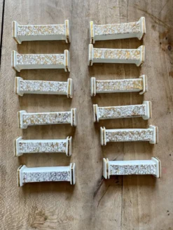 Lot de 10 porte-couteaux vintage art déco en céramique blanche et dorée