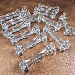 Lot de 12 repose-couteaux et fourchettes anciens en verre épais transparent