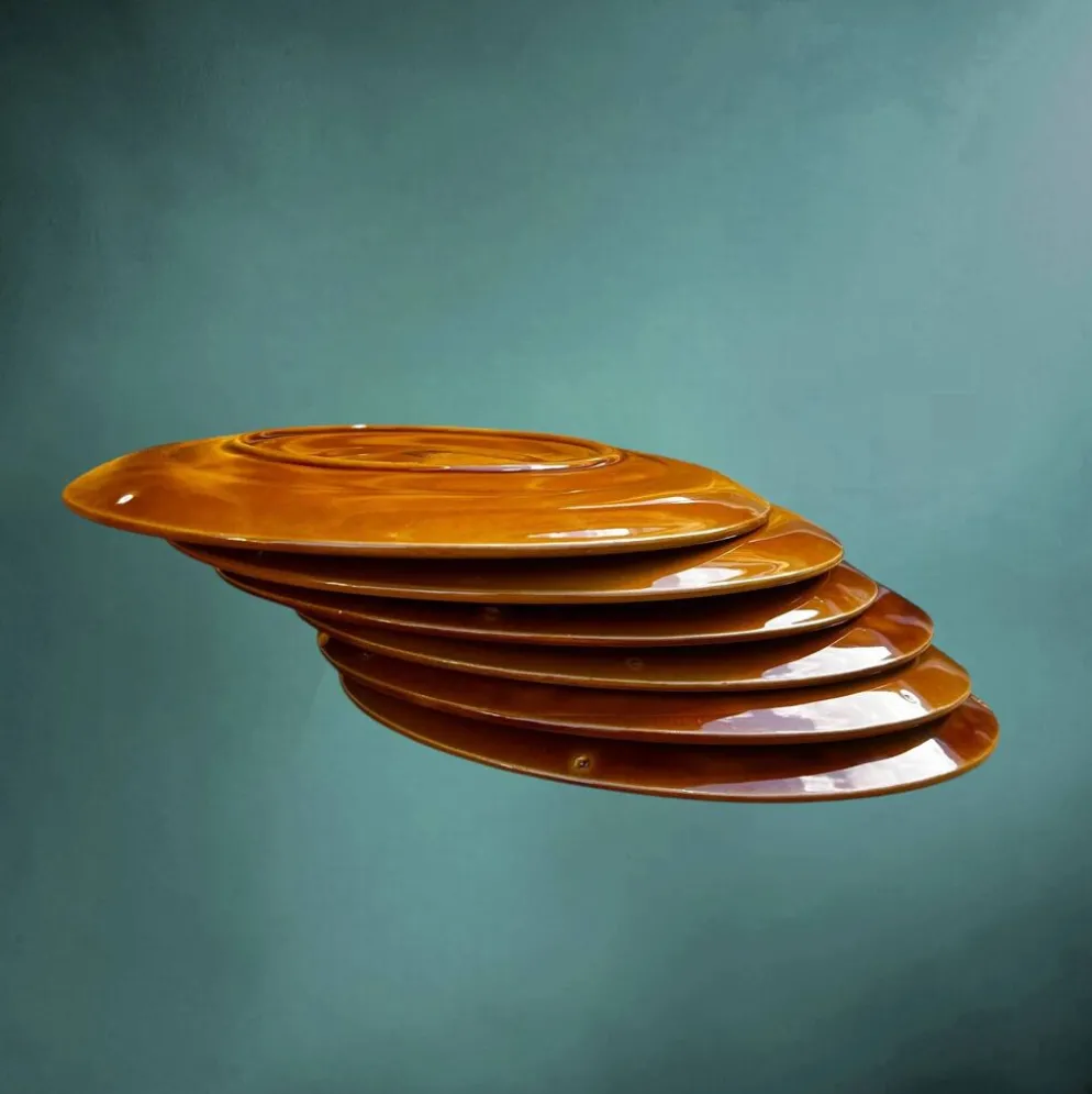 Lot de six assiettes à huîtres Niderviller en faïence émaillée caramel – années 60