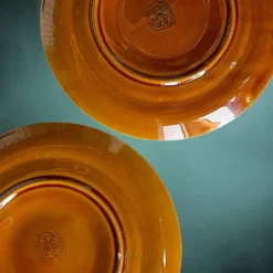 Lot de six assiettes à huîtres Niderviller en faïence émaillée caramel – années 60
