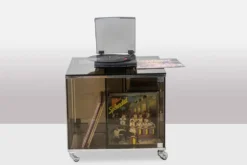 Maison Jansen. Meuble pour vinyles en verre fumé. Années 1970.