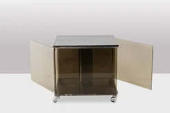 Maison Jansen. Meuble pour vinyles en verre fumé. Années 1970.