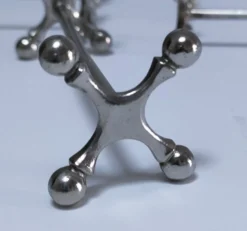 Onze porte-couteau "croisillons" métal design années 70