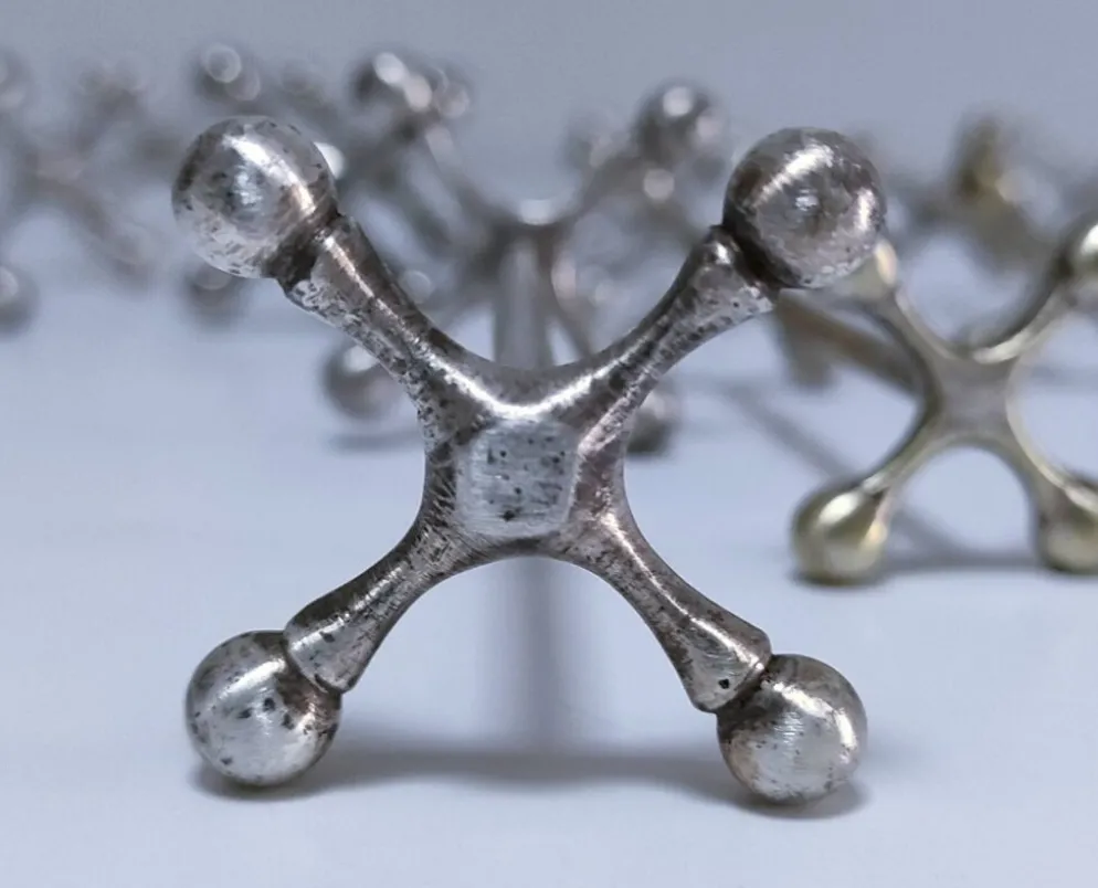 Onze porte-couteau "croisillons" métal design années 70