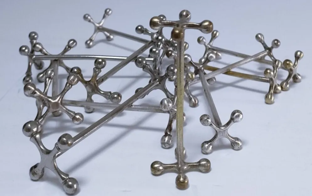 Onze porte-couteau "croisillons" métal design années 70