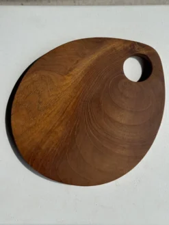 Petite planche à découper en teck monoxyle circulaire à anse 22 x 13