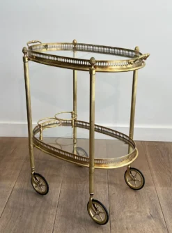 Petite table roulante ovale en laiton à double plateaux amovibles de la Maison Bagués