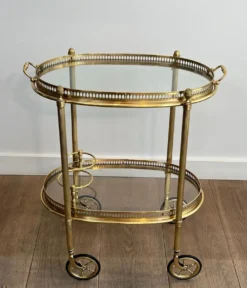 Petite table roulante ovale en laiton à double plateaux amovibles de la Maison Bagués