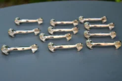 12 porte couteaux chat en métal argenté
