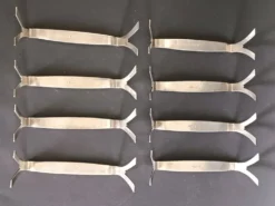 8 porte-couteaux en métal argenté, décor de palmettes, WMF 1880