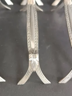 8 porte-couteaux en métal argenté, décor de palmettes, WMF 1880