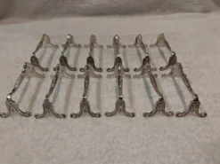 12 porte couteaux métal argenté Christofle Marie Antoinette LXVI