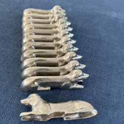12 porte-couteaux teckel en métal