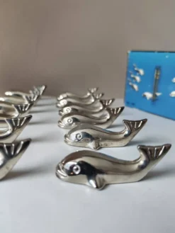 12 reposes-couteau en métal argenté baleine