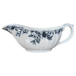 Saucière ancienne en faïence à décor floral