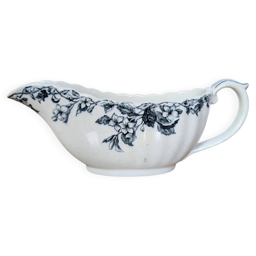 Saucière ancienne en faïence à décor floral