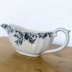 Saucière ancienne en faïence à décor floral