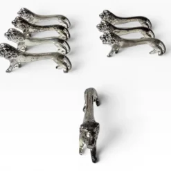 Series of antique knife rests in the shape of a lion, silver-plated metal.