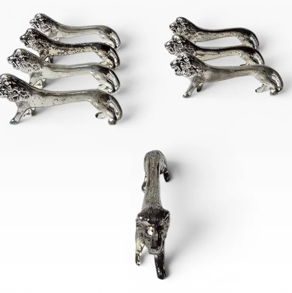 Series of antique knife rests in the shape of a lion, silver-plated metal.