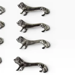 Series of antique knife rests in the shape of a lion, silver-plated metal.