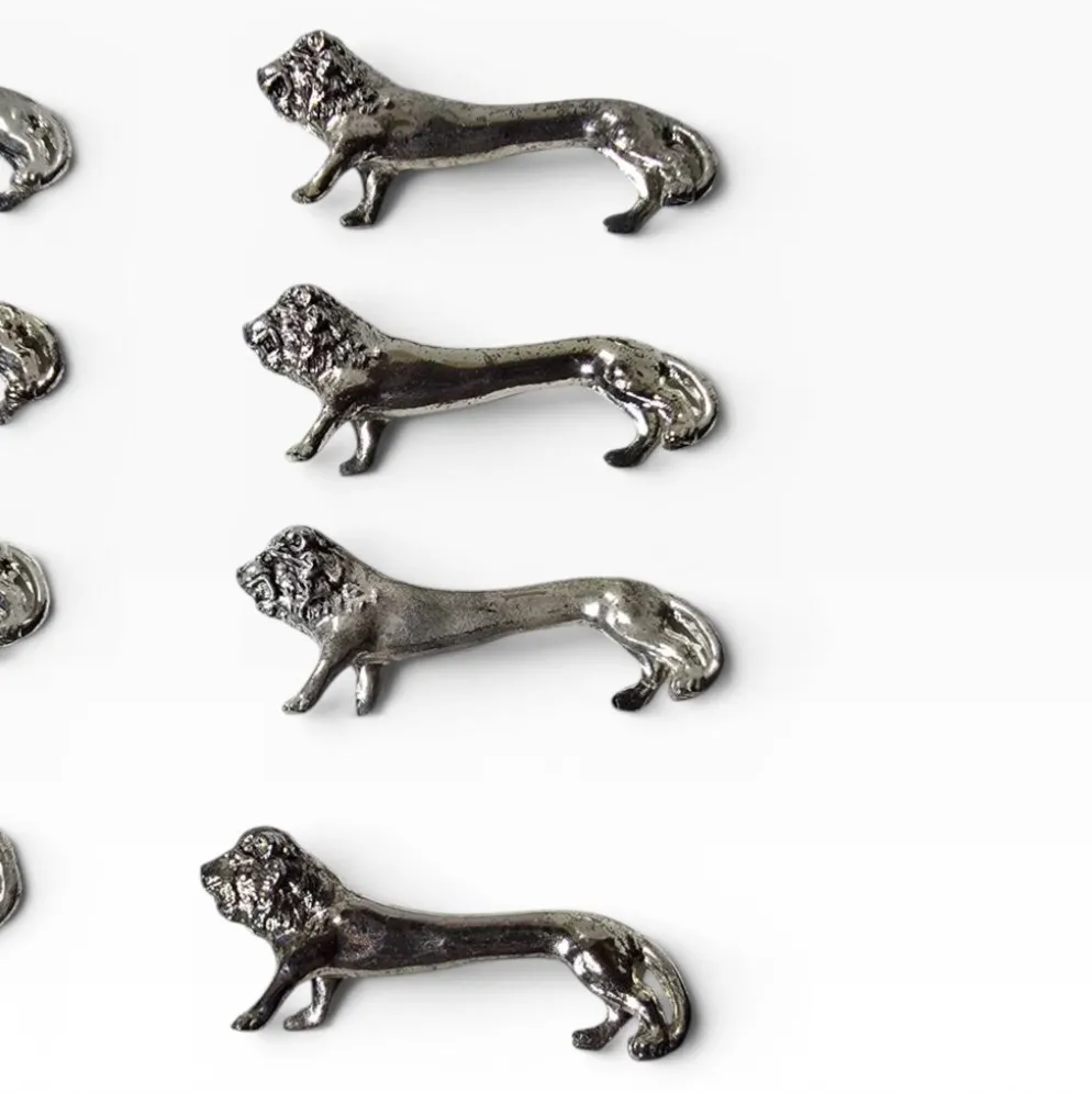 Series of antique knife rests in the shape of a lion, silver-plated metal.