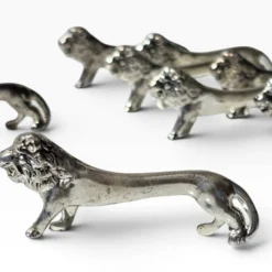 Series of antique knife rests in the shape of a lion, silver-plated metal.