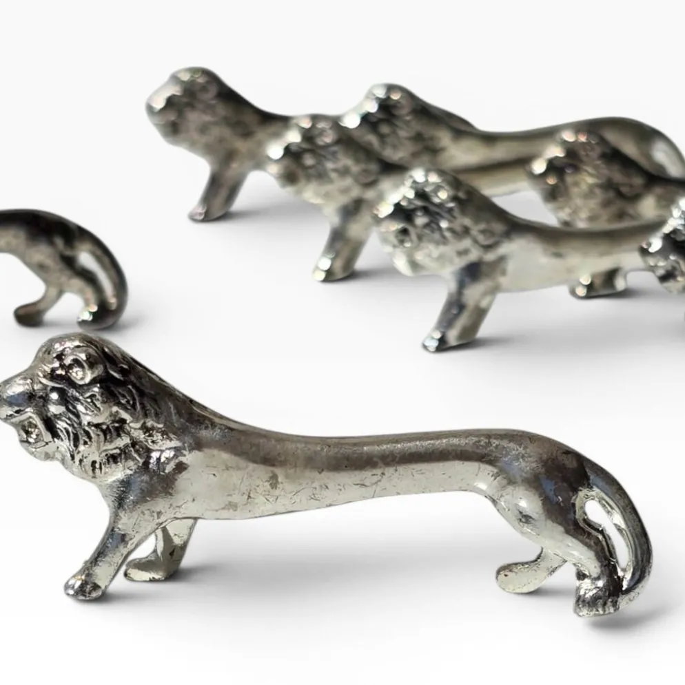 Series of antique knife rests in the shape of a lion, silver-plated metal.