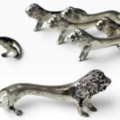 Series of antique knife rests in the shape of a lion, silver-plated metal.
