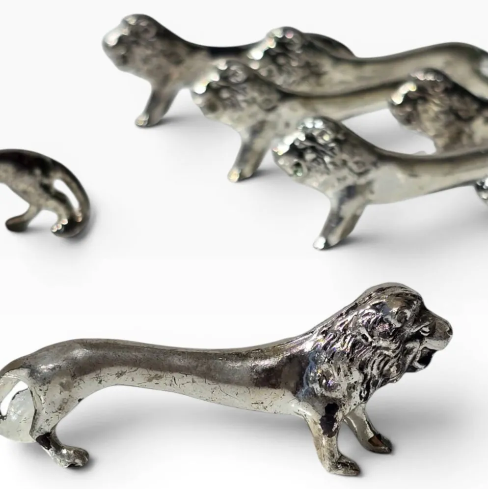 Series of antique knife rests in the shape of a lion, silver-plated metal.
