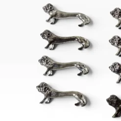 Series of antique knife rests in the shape of a lion, silver-plated metal.