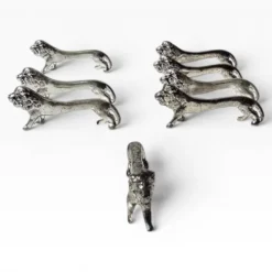 Series of antique knife rests in the shape of a lion, silver-plated metal.