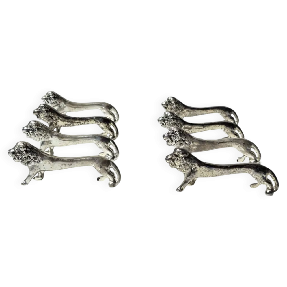 Series of antique knife rests in the shape of a lion, silver-plated metal.