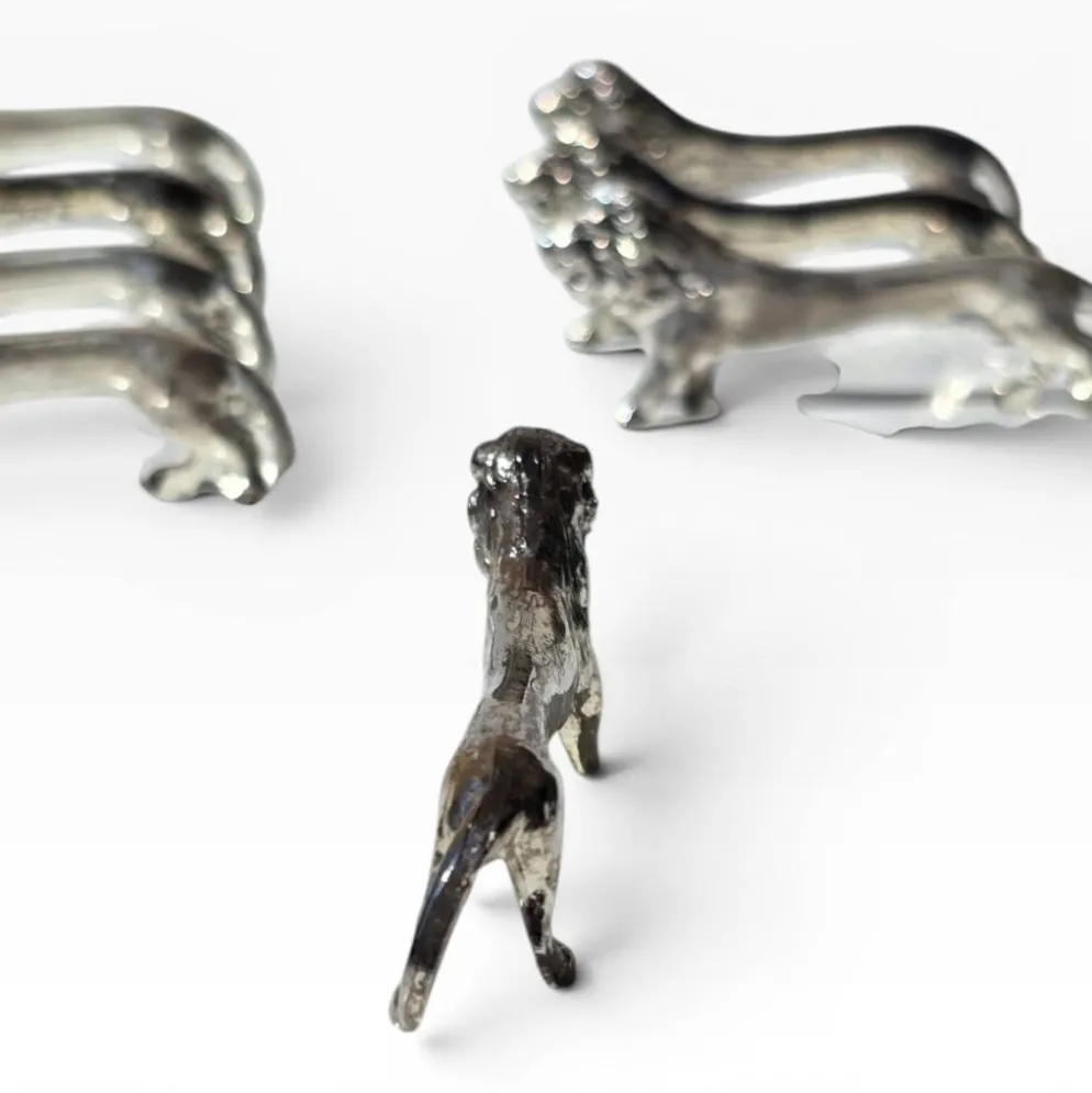 Series of antique knife rests in the shape of a lion, silver-plated metal.