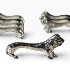 Series of antique knife rests in the shape of a lion, silver-plated metal.