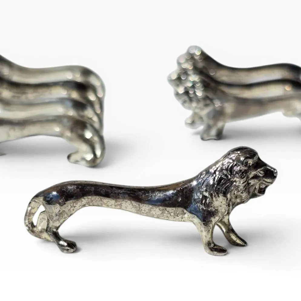 Series of antique knife rests in the shape of a lion, silver-plated metal.