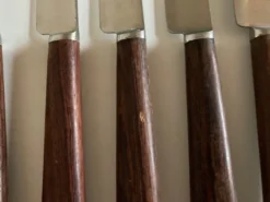 Set de 9 couteaux à manche de bois de palissandre mid century