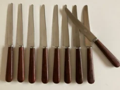 Set de 9 couteaux à manche de bois de palissandre mid century