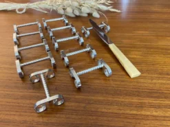 Set de 11 porte couteaux en métal argenté 1960