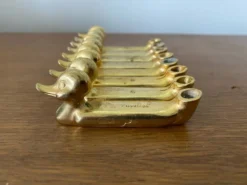 Série de 8 anciens portes couteaux privilège metal doré canard vintage